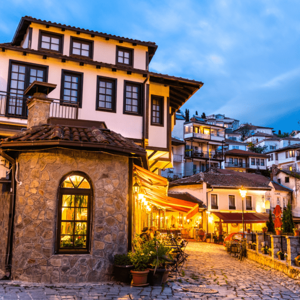 Home in North Macedonia with lights on and many houses