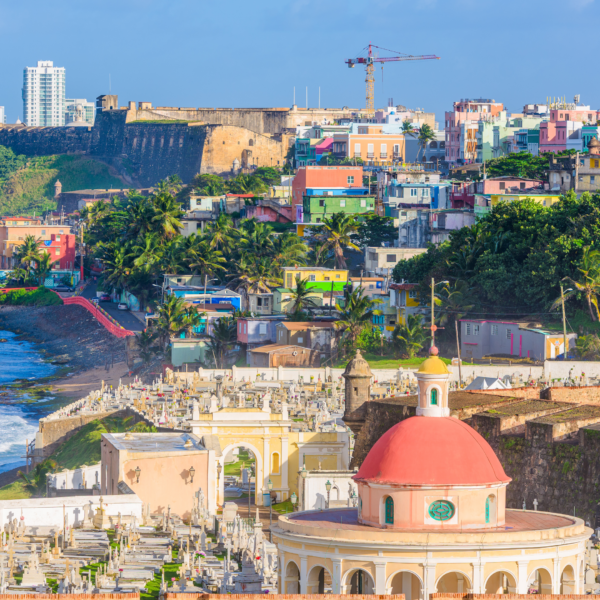 puerto rico beach and fort with city in background
