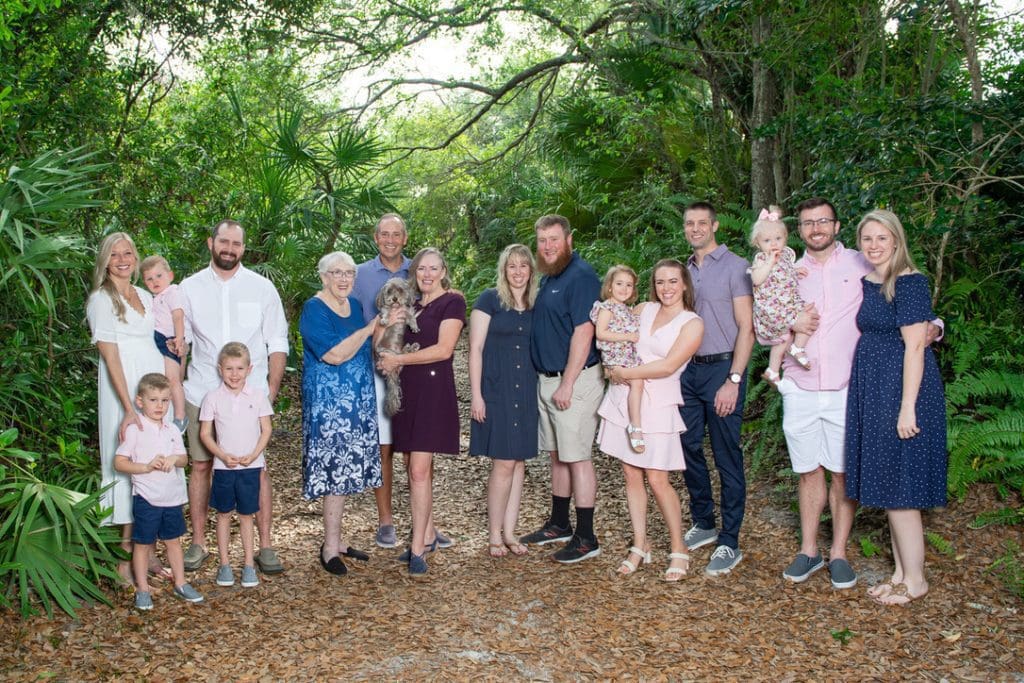 a group of family members dressed up for a family photo