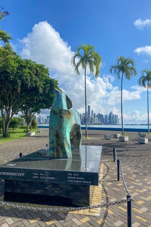 view of statue in park with panama city skyline in background