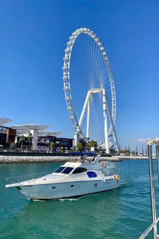 world’s biggest Ferris Wheel with boat in foreground in Dubai