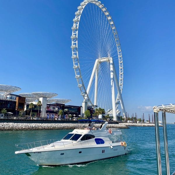 world’s biggest Ferris Wheel with boat in foreground in Dubai