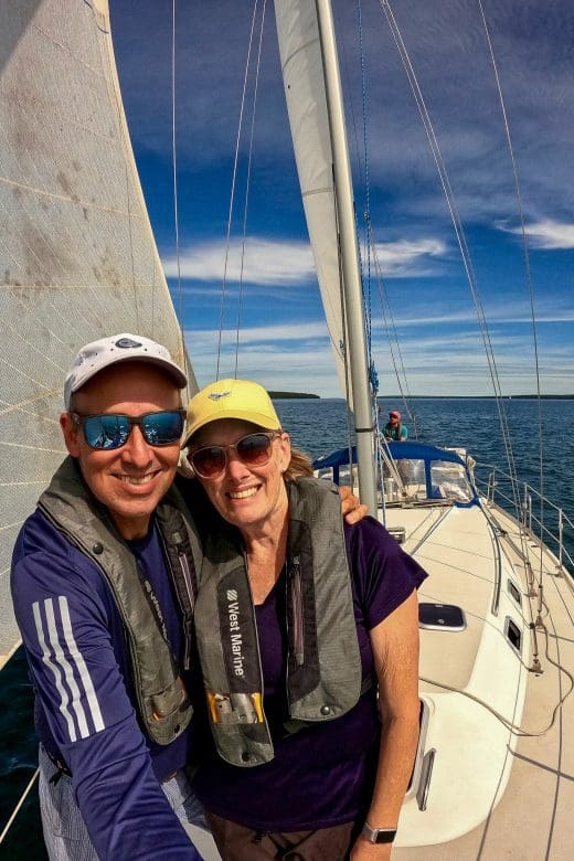 two people on sailboat in the Apostle Islands