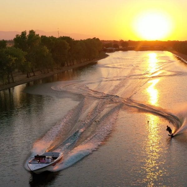 drone view of water skiing at sunset