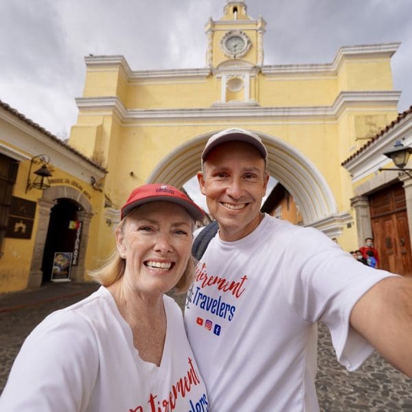 john & bev in front of yellow santa catalina arch in guatemala