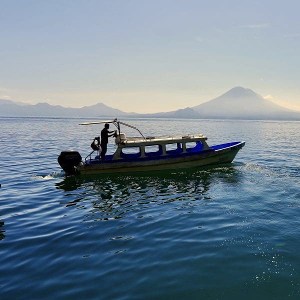 boat with volcano in rear
