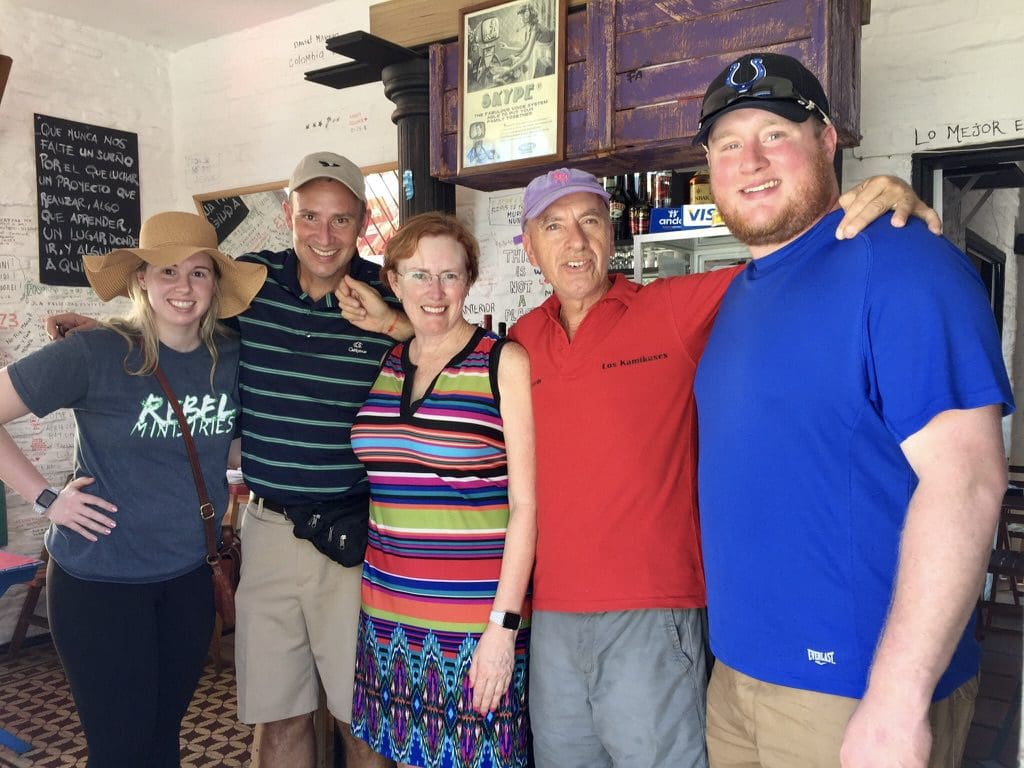 five people posing for picture