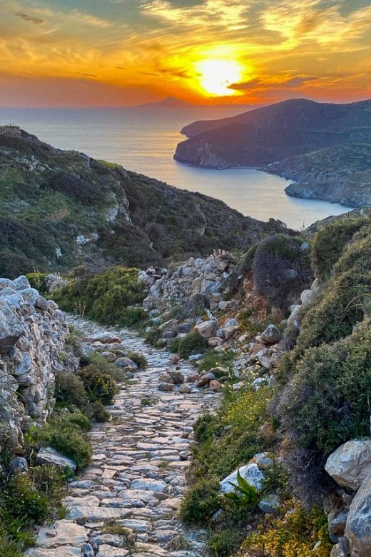 sunset in background, rocky path in foreground on Folegandros Greece