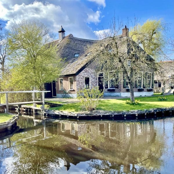 cottage along the water with reflection in Giethoorn Netherlands