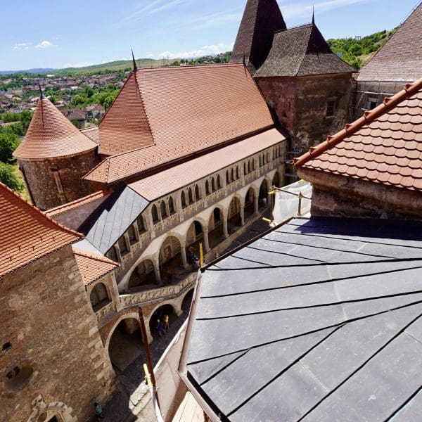 a view of the orange roof lines of castle