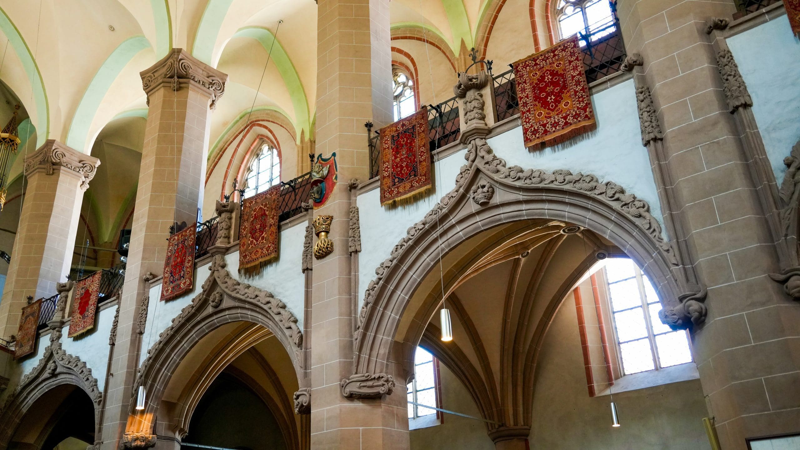 tapestries hanging from top of church