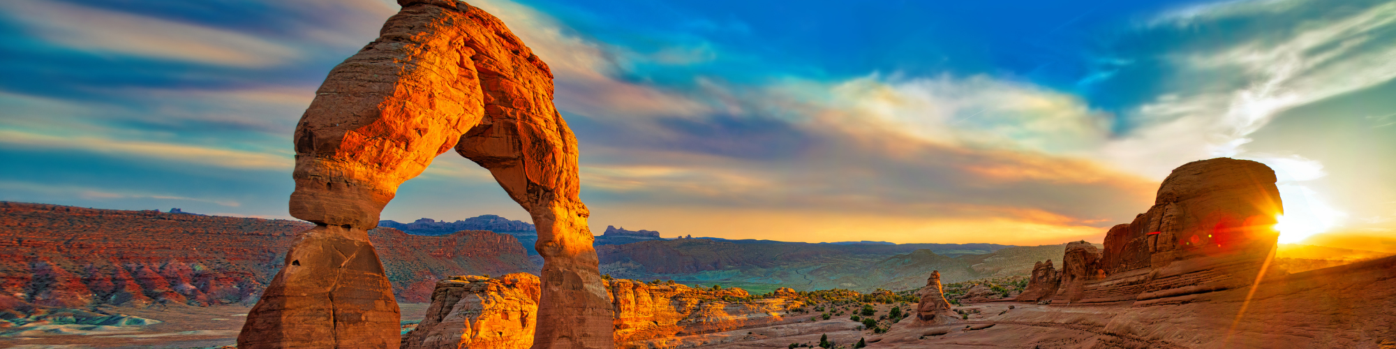 view at sunset of arch in arches national park