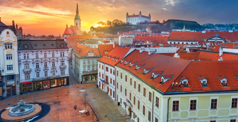 A view of the square and church with Bratislava Castle in background