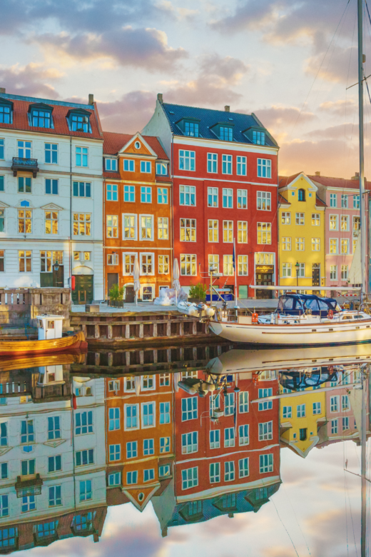 Canal in Copenhagen Denmark with colorful houses reflecting in the water