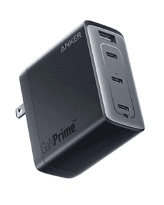 An electrical charger that is black and has ports for three "C" plugs and one USB Plug