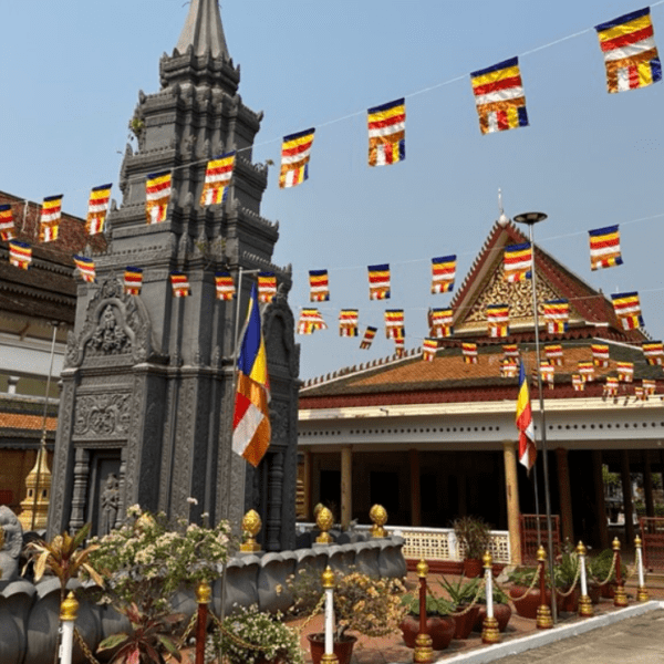 Temple with flag banners in a town square